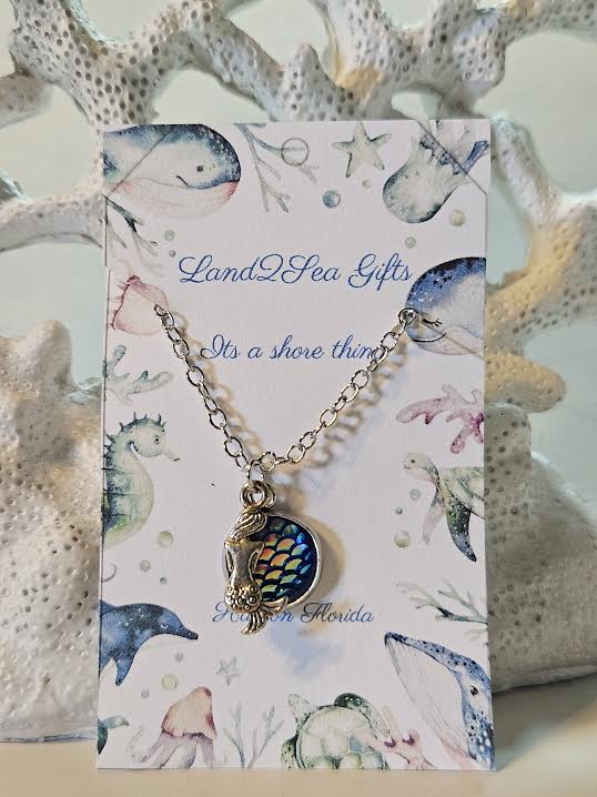 ππ βChannel your inner mermaid π§ββοΈβ¨ This shimmering scales pendant is the perfect touch of ocean magic to complete your look!β ππ΄
