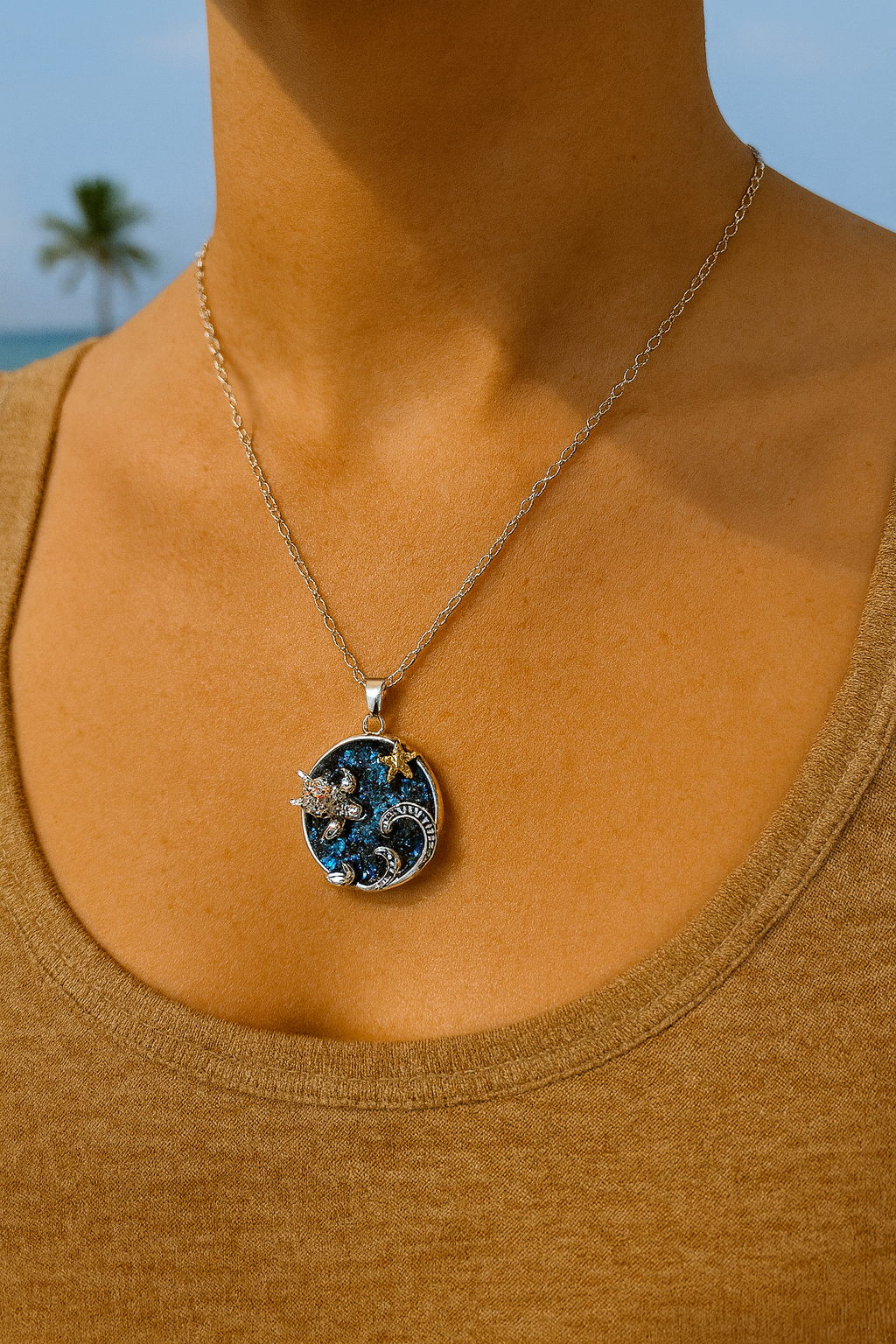 ✨🌴 “Carry the ocean wherever you go 🌊🐢💫 This stunning wave pendant with turtle & starfish details is a little piece of paradise you can wear every day!” 🐚💙