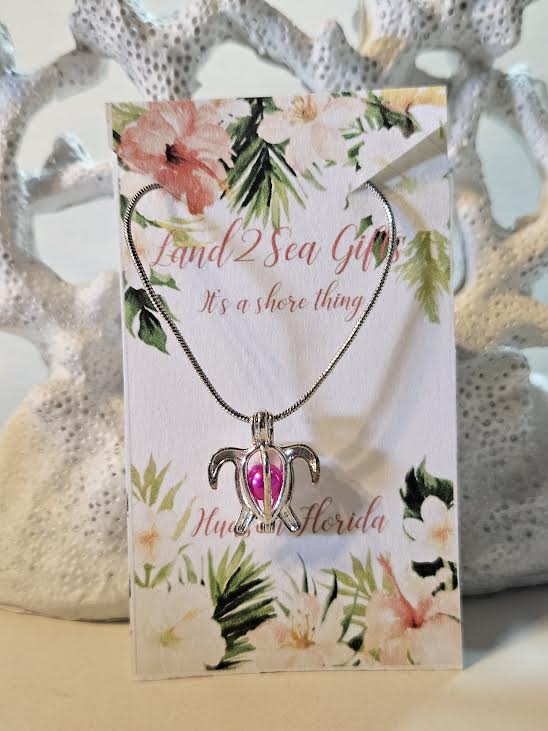 ✨🌊 “Sea the beauty 🐢💖 This silver turtle pendant with a shimmering pink bead is the perfect touch of ocean charm & coastal style.” 🌴🌸