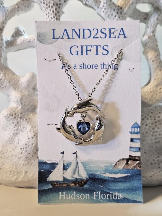 ✨🌊 “Dive into elegance 🐬💙 This silver dolphin trio pendant with a sparkling ocean-blue heart is the perfect symbol of love, freedom, and the sea.” 🌴💎