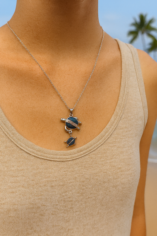 ✨🌊 “A love as deep as the ocean 💙🐢 This momma & baby turtle pendant is the sweetest symbol of family, strength, and sea spirit.” 🌴🐚