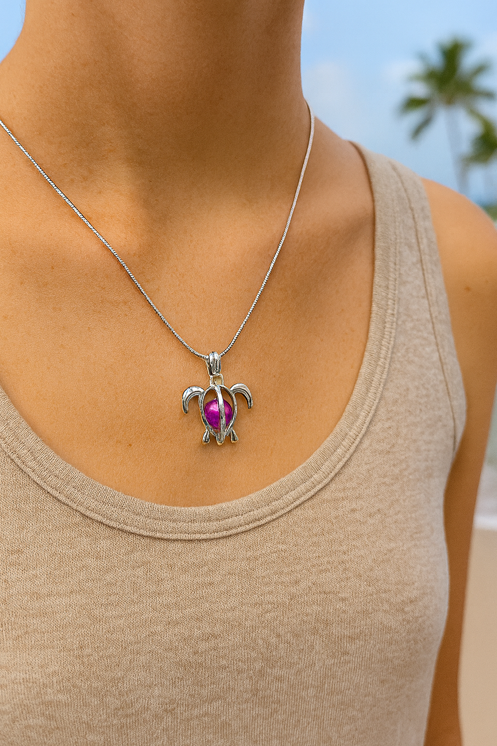 ✨🌊 “Sea the beauty 🐢💖 This silver turtle pendant with a shimmering pink bead is the perfect touch of ocean charm & coastal style.” 🌴🌸